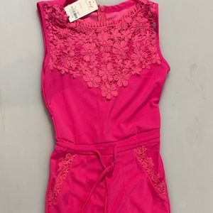 Jumpsuit with lace top and pants pockets.
